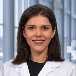 a woman with mid-length brown hair